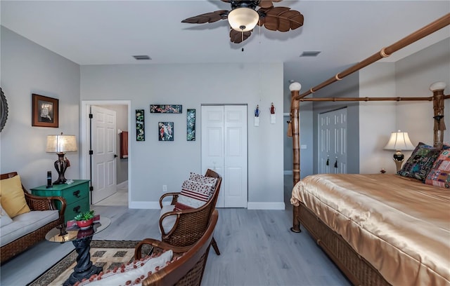 bedroom featuring light wood-type flooring and ceiling fan