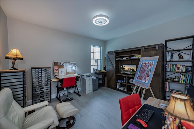 office with light wood-type flooring