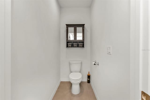 bathroom featuring tile patterned floors and toilet