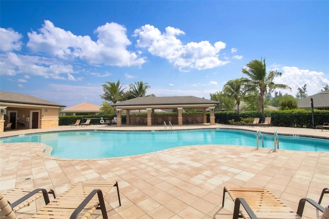 view of pool featuring a gazebo and a patio area