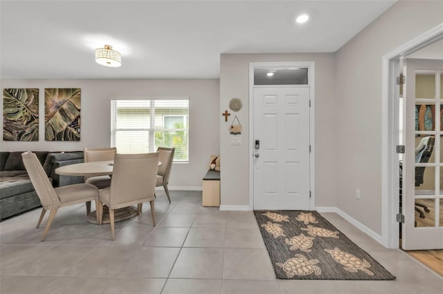 foyer featuring light tile patterned flooring