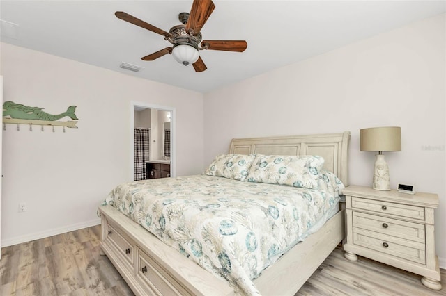 bedroom featuring ensuite bathroom, ceiling fan, and light hardwood / wood-style floors