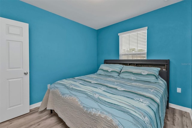 bedroom featuring wood-type flooring