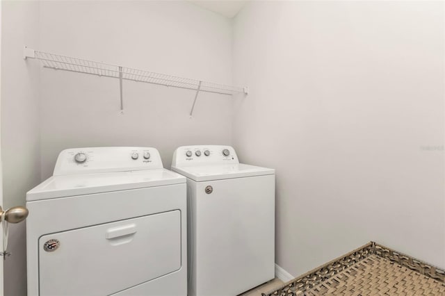 washroom with washer and dryer