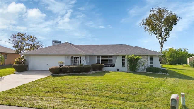 ranch-style house featuring a garage and a front yard