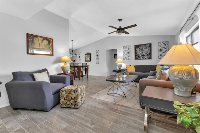 living room with ceiling fan and vaulted ceiling