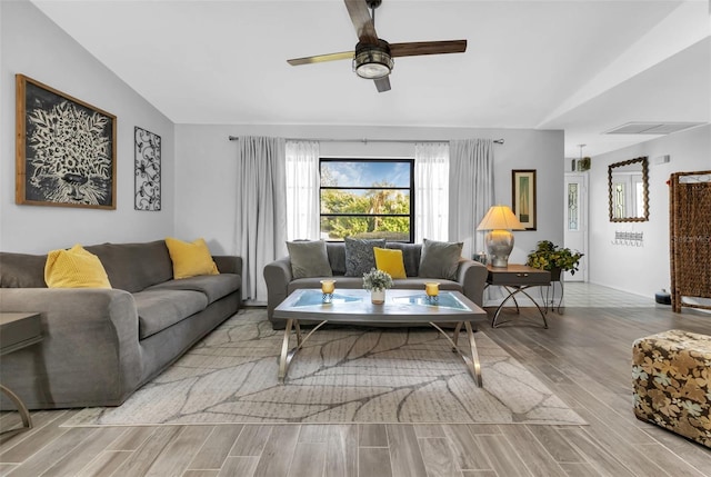 living room with vaulted ceiling and ceiling fan