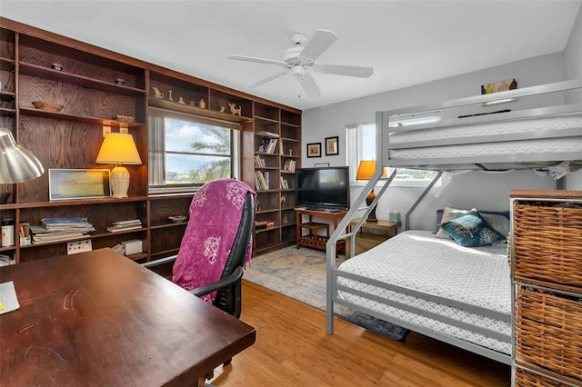 bedroom with light wood-type flooring and ceiling fan