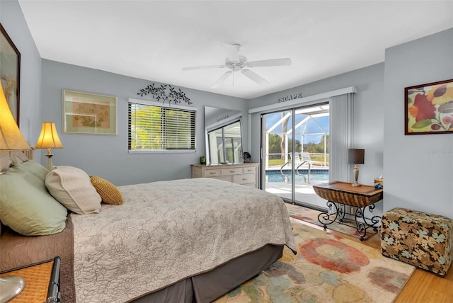 bedroom with ceiling fan, access to outside, and wood-type flooring