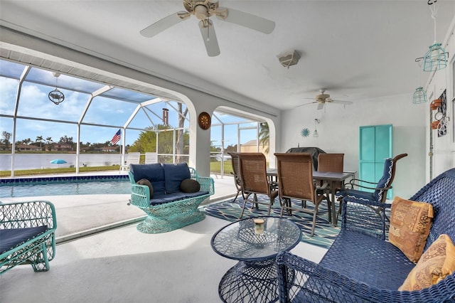 sunroom / solarium with a water view