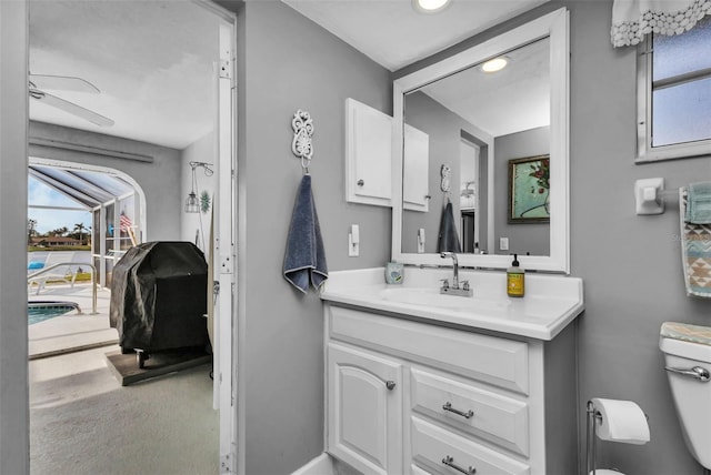 bathroom with toilet and vanity