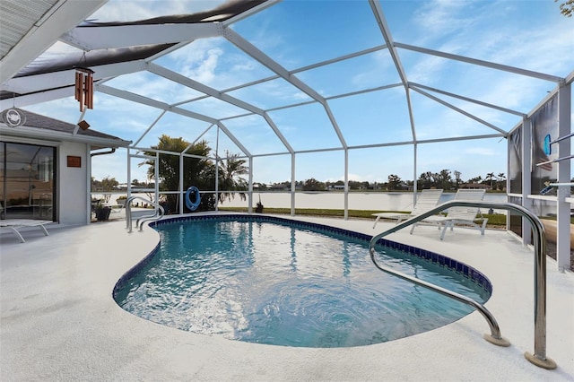 view of pool featuring glass enclosure and a patio area