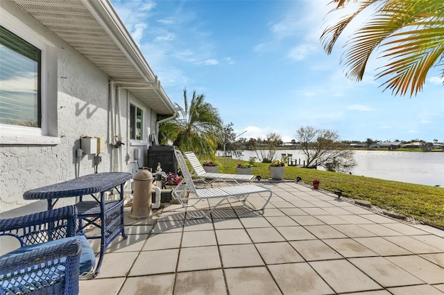 view of patio with a water view