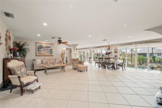 tiled living room featuring ceiling fan