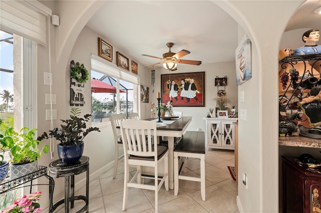 dining room featuring ceiling fan and light tile patterned floors