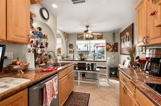 kitchen with black electric stovetop, dishwasher, sink, dark stone counters, and light tile patterned flooring