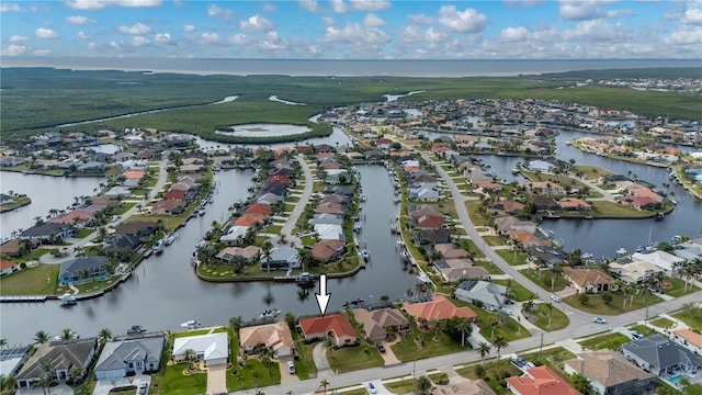 birds eye view of property featuring a water view