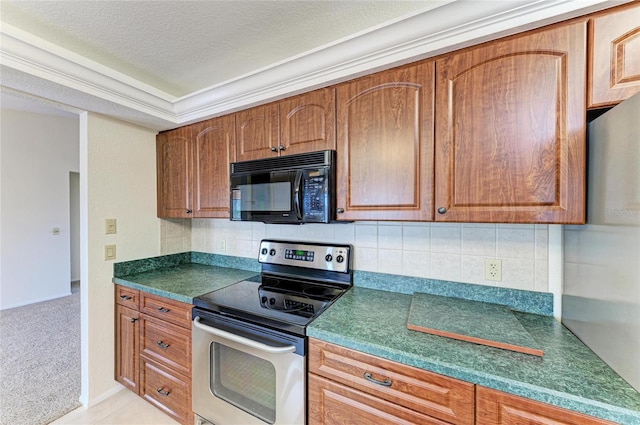 kitchen featuring tasteful backsplash, light carpet, stainless steel range with electric cooktop, and a textured ceiling