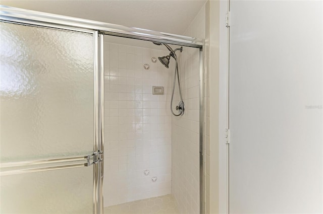 bathroom with a shower with shower door