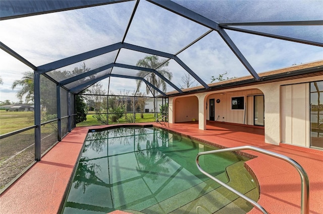 view of pool with a patio and a lanai