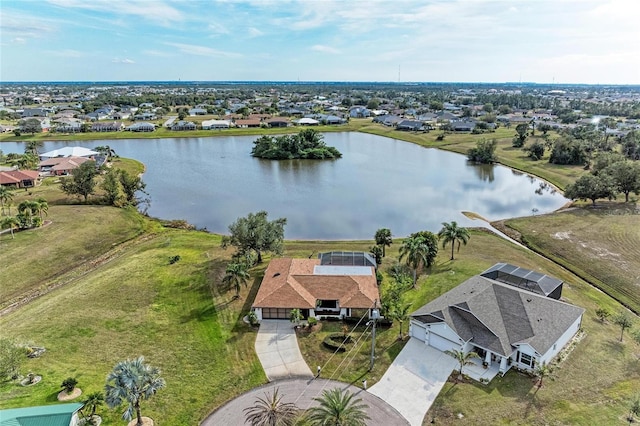 birds eye view of property with a water view and a residential view