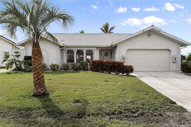 single story home featuring a garage and a front lawn