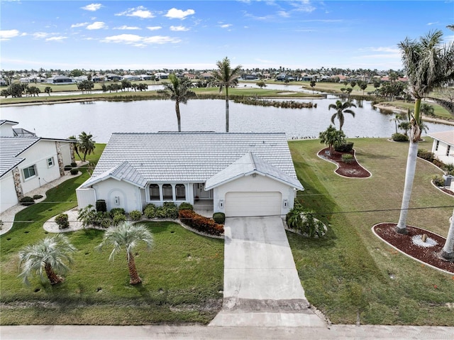 birds eye view of property with a water view