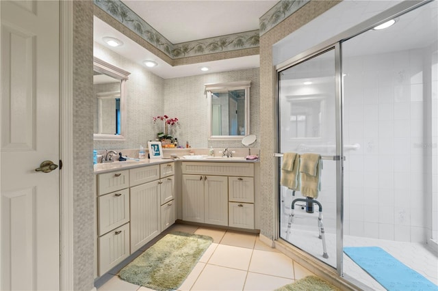 bathroom featuring vanity, tile patterned flooring, and a shower with door