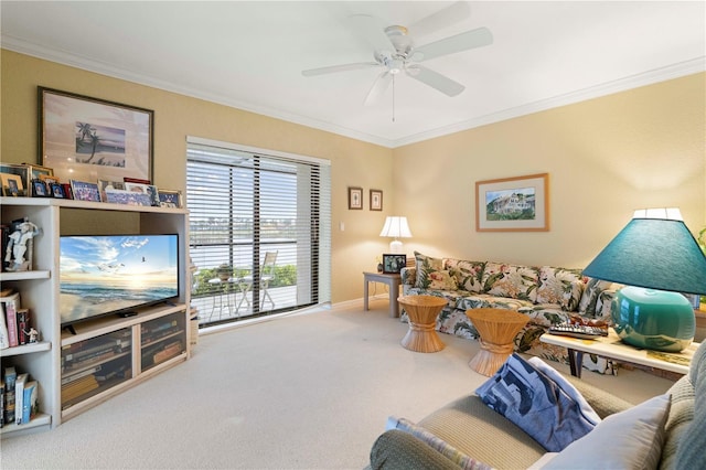 living room featuring crown molding, carpet, and ceiling fan