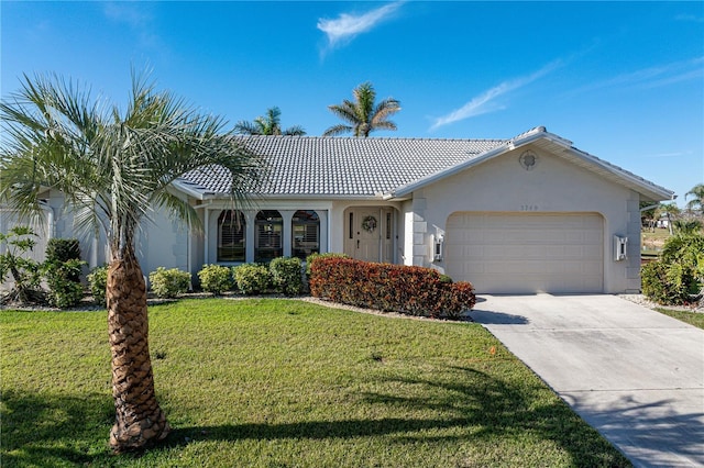 view of front of house featuring a garage and a front lawn