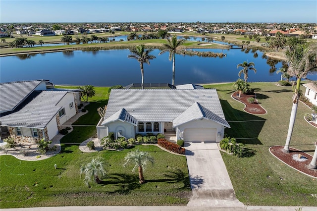 birds eye view of property with a water view