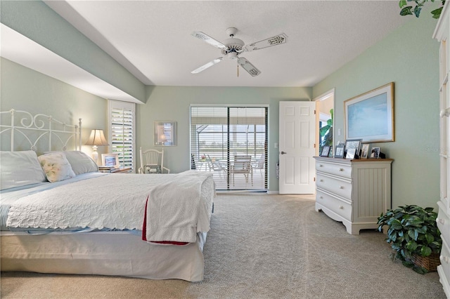 bedroom featuring light carpet, multiple windows, ceiling fan, and access to outside