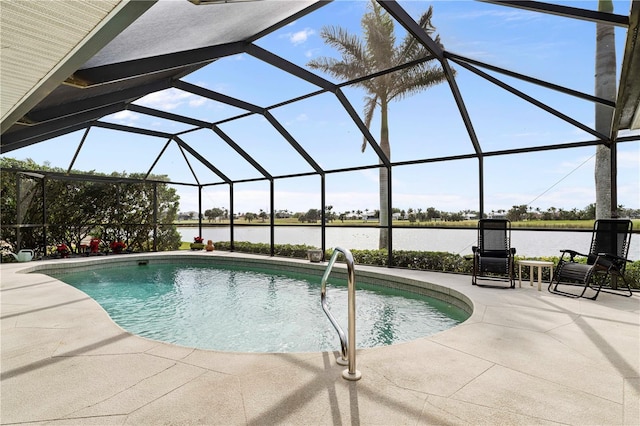 view of swimming pool featuring a patio area, a water view, and glass enclosure