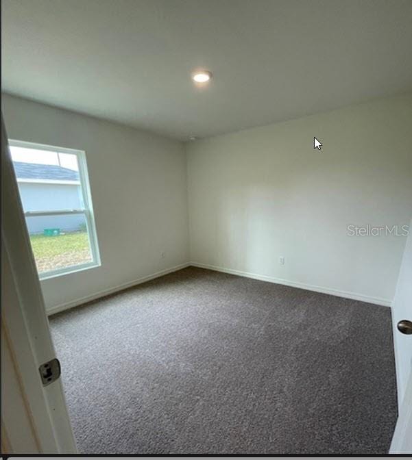 spare room with carpet flooring