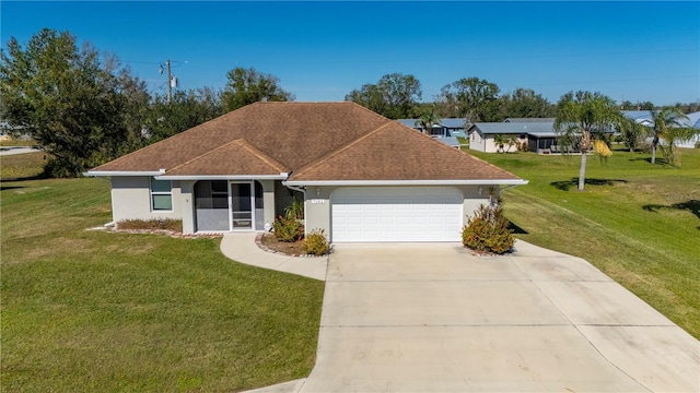 single story home featuring a garage and a front yard