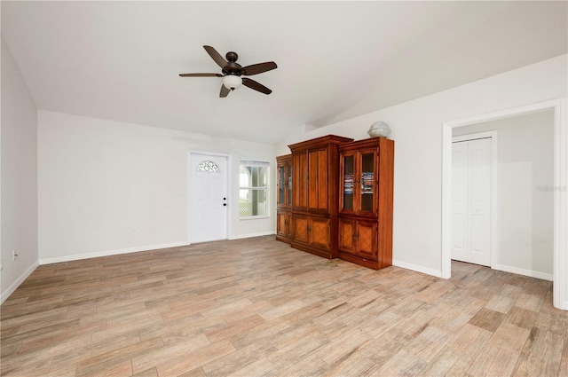 unfurnished living room featuring light hardwood / wood-style flooring, ceiling fan, and vaulted ceiling