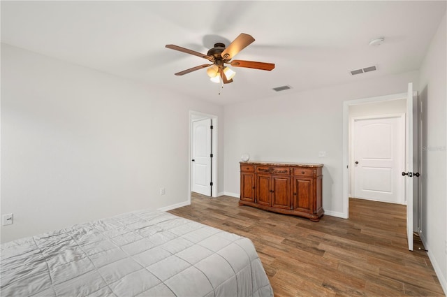 bedroom with ceiling fan and hardwood / wood-style floors