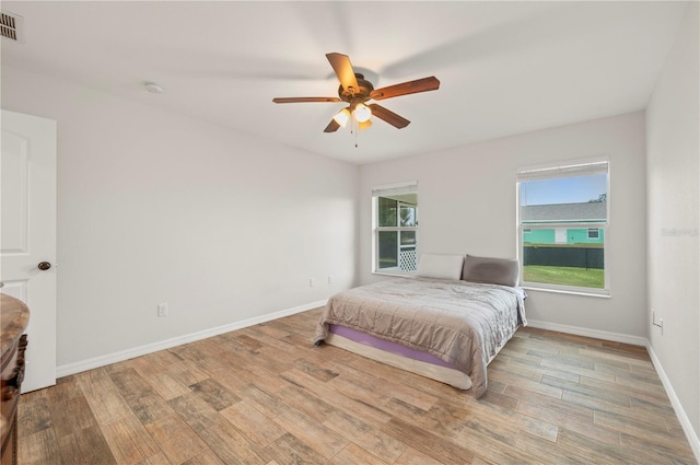 bedroom featuring light hardwood / wood-style floors and ceiling fan