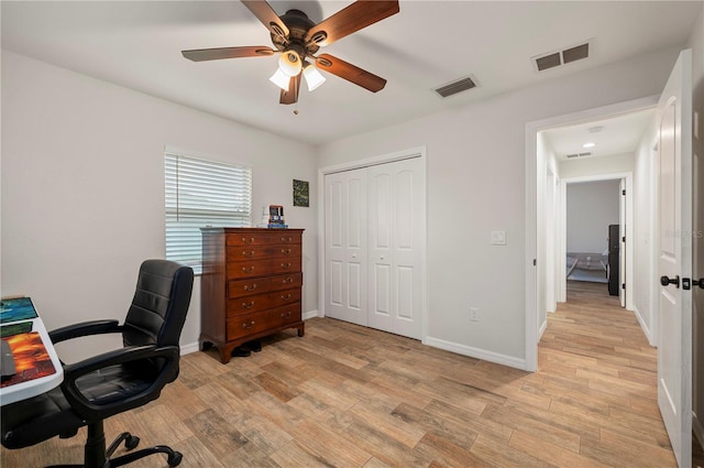 office space with ceiling fan and light wood-type flooring