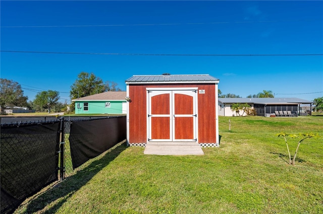 view of outbuilding featuring a yard