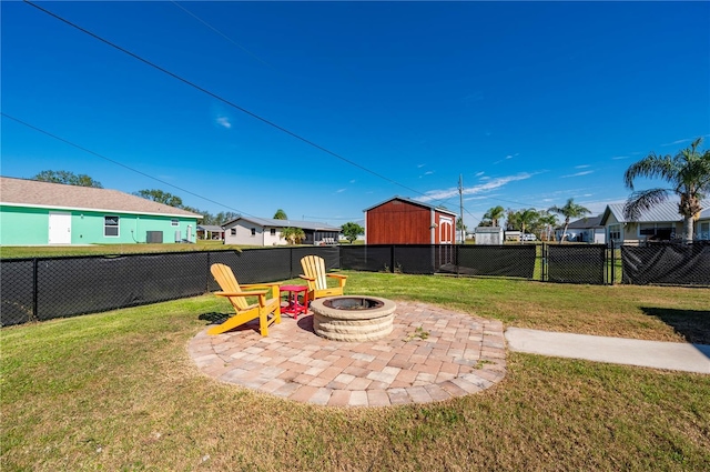 view of yard featuring an outdoor fire pit and a patio