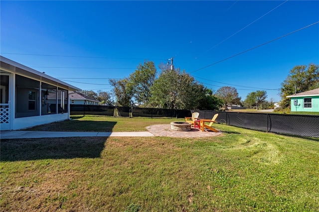 view of yard featuring an outdoor fire pit