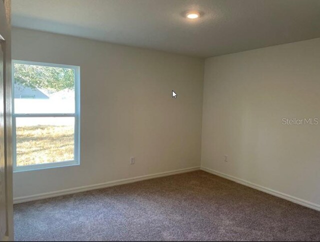 view of carpeted spare room