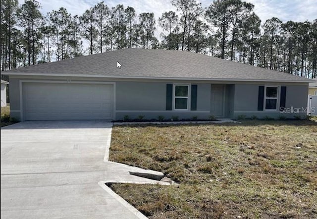 ranch-style house with a garage and a front lawn