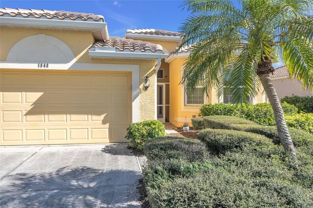 mediterranean / spanish-style house featuring a garage