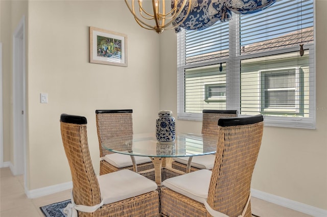 tiled dining space with an inviting chandelier