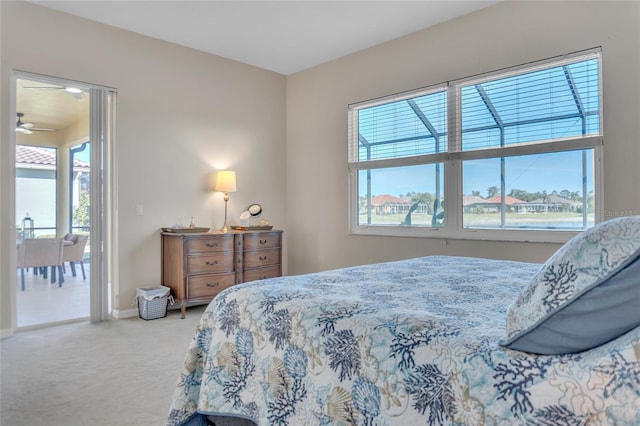 bedroom with multiple windows and carpet flooring