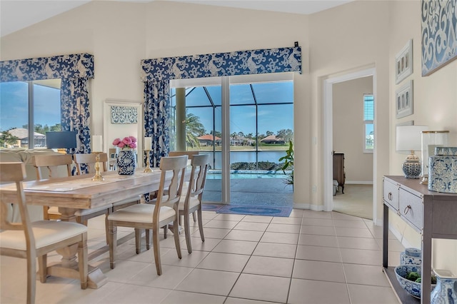 tiled dining room with a water view