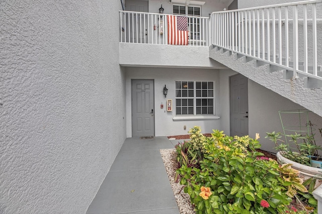 property entrance with a balcony