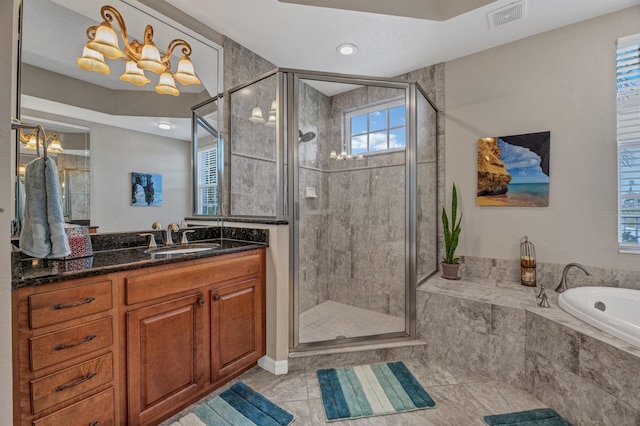 bathroom featuring vanity, shower with separate bathtub, and tile patterned floors